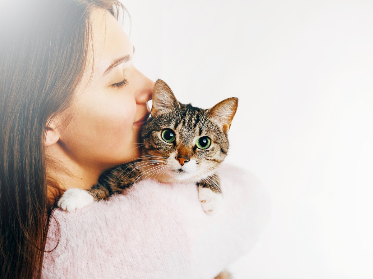 a women holding a cat